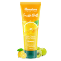 Himalaya Fresh Start Oil Clear Face Wash Lemon tube with lemon slices and gooseberries on a white background