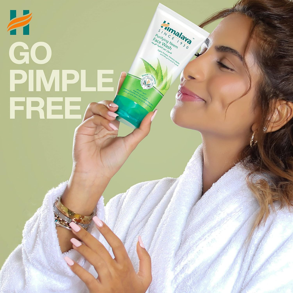 Woman in a white robe holding a Himalaya skincare product with text 'Go Pimple Free' on a green background.