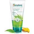 Himalaya Herbals Purifying Neem Face Wash tube with neem leaf and turmeric on a white background