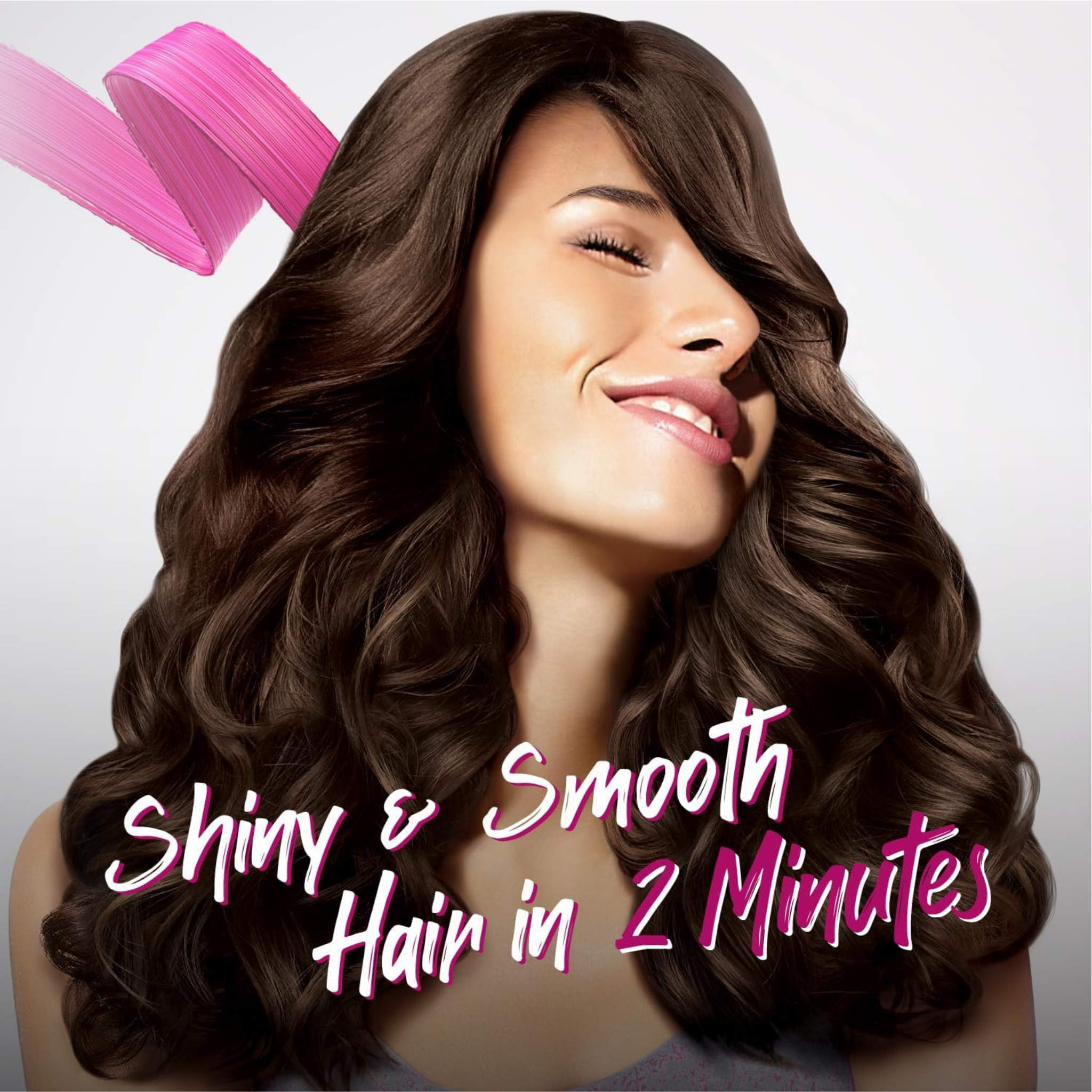 Woman with shiny, smooth hair and pink hair product on a light gray background
