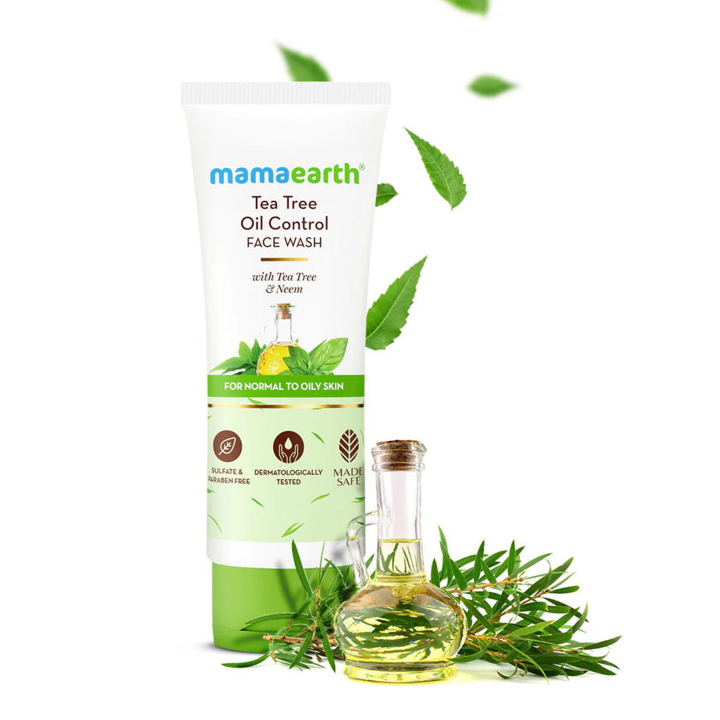 Mamaearth Tea Tree Oil Control Face Wash with oil bottle and neem leaves on a white background