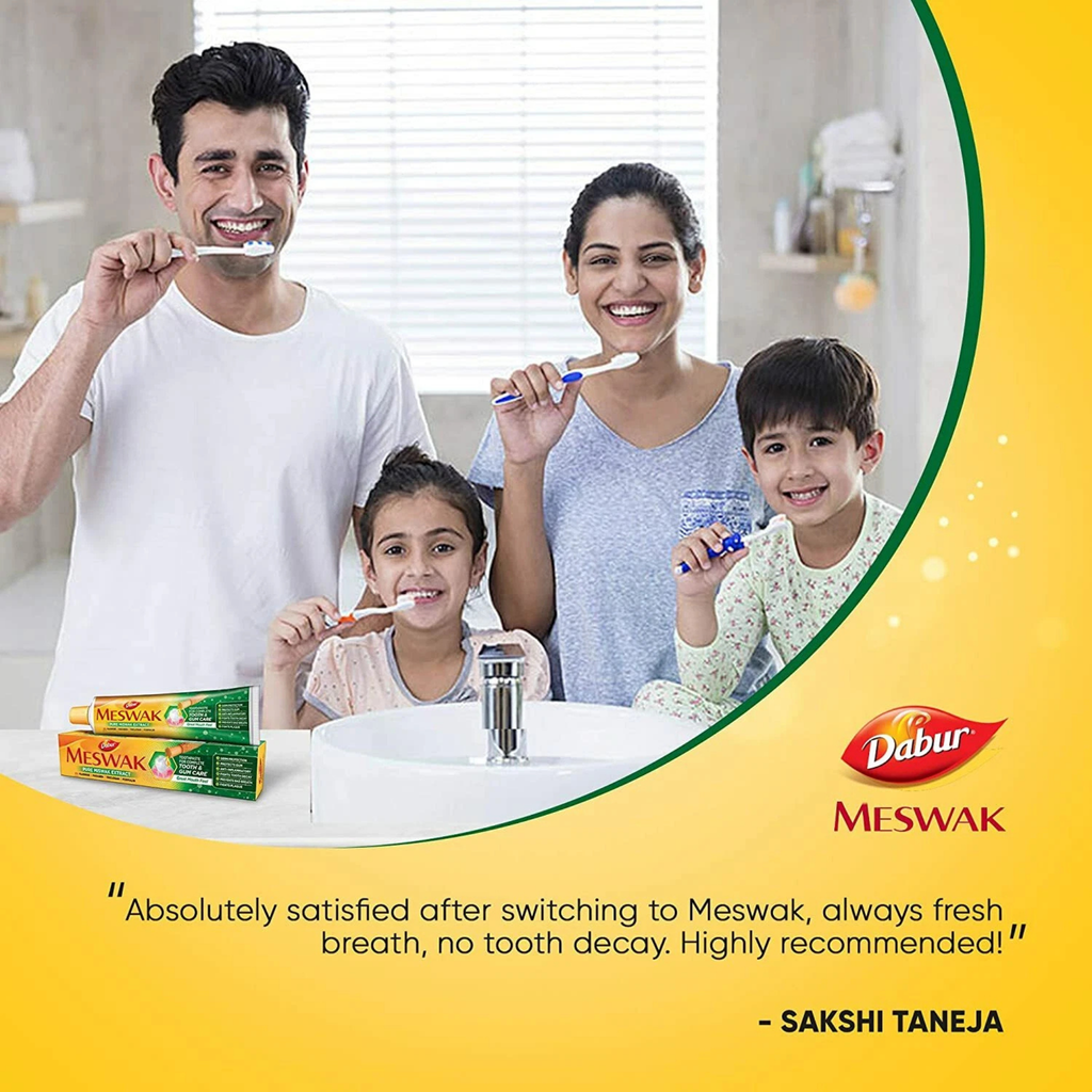Family brushing their teeth together with Meswak products, featuring Dabur Meswak branding.