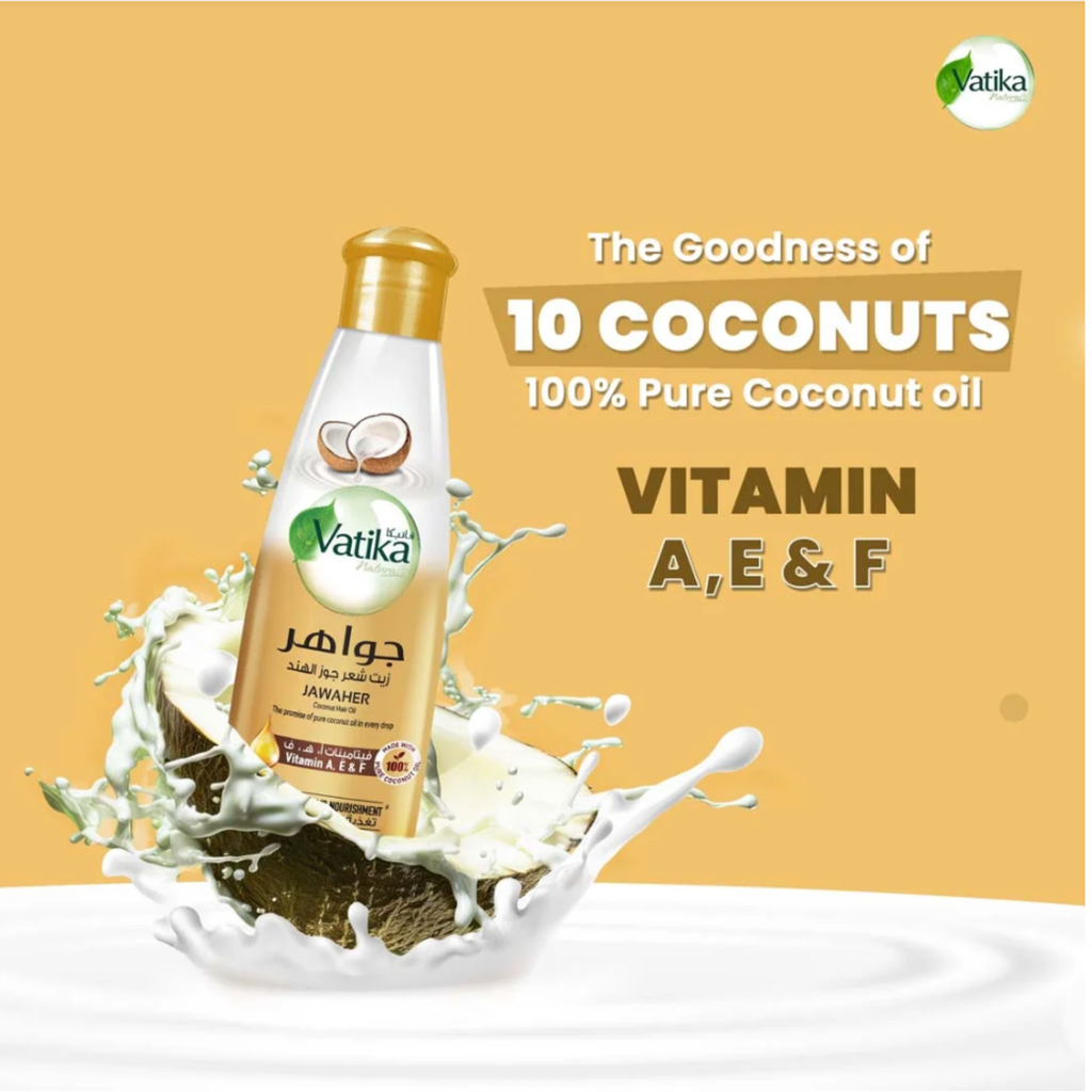 Vatika coconut oil bottle with coconut and splashes on a yellow background