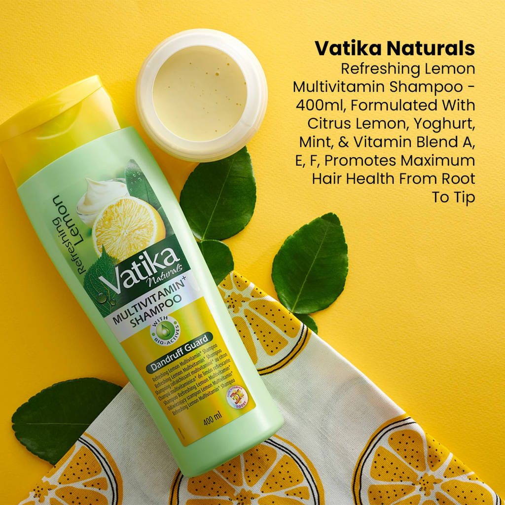 Vatika Naturals Lemon Multivitamin Shampoo bottle with lemon slices and leaves on a yellow background