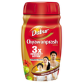 Dabur Chyawanprash herbal supplement with red lid and yellow body on a white background.